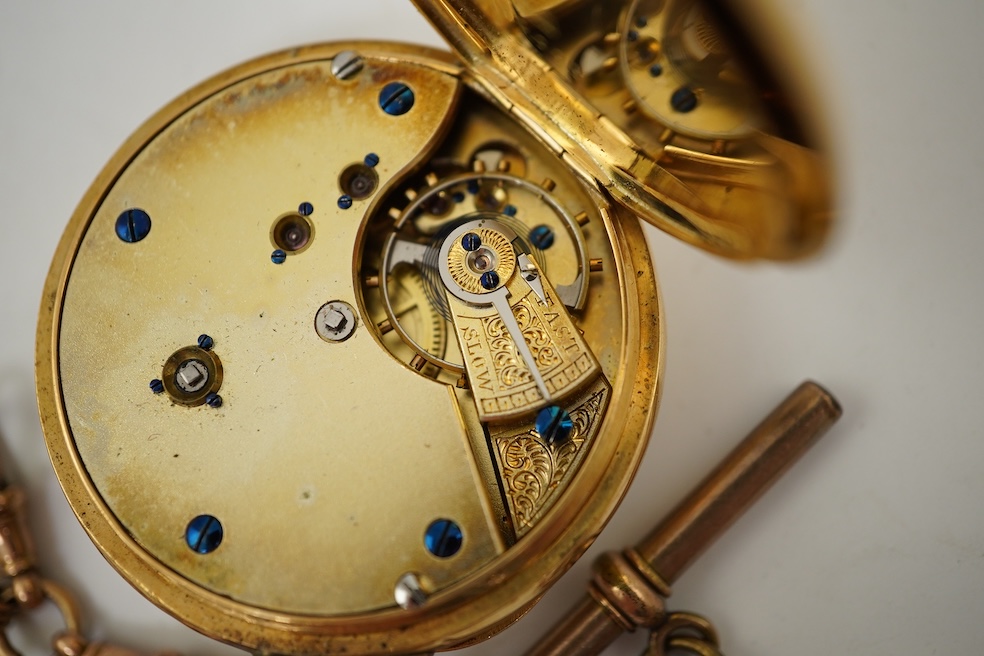 A continental 18k gold open faced keyless lever pocket watch, with a 9ct albert